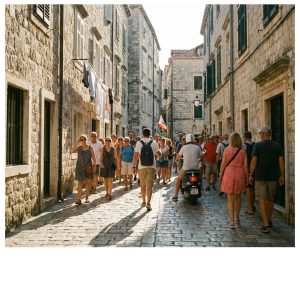 Tour guide leading a large group along a narrow old-town street